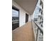 Spacious balcony with tiled flooring and glass railings, offering city views at 200 W Sahara Ave # 1609, Las Vegas, NV 89102