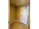 Neutral colored hallway with tile flooring and door at 200 W Sahara Ave # 1609, Las Vegas, NV 89102