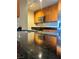 Granite countertops and wood cabinets in this updated kitchen at 200 W Sahara Ave # 1609, Las Vegas, NV 89102