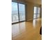 Living room with hardwood floors and sliding doors leading to a balcony at 200 W Sahara Ave # 1609, Las Vegas, NV 89102