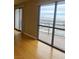 Living room with hardwood floors and large windows with city view at 200 W Sahara Ave # 1609, Las Vegas, NV 89102