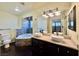 Elegant bathroom featuring a soaking tub and dual vanities at 4005 Paul Robarts Ct, Las Vegas, NV 89102