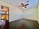 Bright bedroom with dark hardwood floors and ceiling fan at 4005 Paul Robarts Ct, Las Vegas, NV 89102