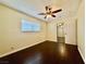 Spacious bedroom with dark hardwood floors and ceiling fan at 4005 Paul Robarts Ct, Las Vegas, NV 89102