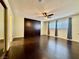 Spacious bedroom with dark hardwood floors and ceiling fan at 4005 Paul Robarts Ct, Las Vegas, NV 89102