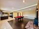 Game room with pool table, kitchen view, and fireplace at 4005 Paul Robarts Ct, Las Vegas, NV 89102