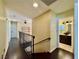 Upstairs hallway with dark hardwood floors and a bathroom at 4005 Paul Robarts Ct, Las Vegas, NV 89102