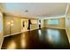 Spacious living room with dark hardwood floors and natural light at 4005 Paul Robarts Ct, Las Vegas, NV 89102