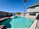 Inviting backyard pool with a slide and rock waterfall feature at 4005 Paul Robarts Ct, Las Vegas, NV 89102