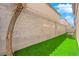 Artificial turf backyard with a block wall and AC unit at 10596 Corte Sierra St, Las Vegas, NV 89183