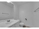 Clean bathroom with single sink vanity, toilet and mirror at 10596 Corte Sierra St, Las Vegas, NV 89183