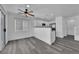 Bright dining area with gray flooring and kitchen access at 10596 Corte Sierra St, Las Vegas, NV 89183