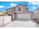 Two-story house with attached garage and a landscaped front yard at 10596 Corte Sierra St, Las Vegas, NV 89183