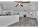 Open living room featuring a fireplace and kitchen island at 10596 Corte Sierra St, Las Vegas, NV 89183