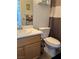 Bathroom featuring a vanity with a sink, a toilet, and a shower with a curtain at 8216 Carmen Blvd, Las Vegas, NV 89128