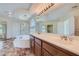 Elegant bathroom boasts a large soaking tub and double vanity at 4327 Melrose Abbey Pl, Las Vegas, NV 89141