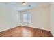 Simple bedroom with hardwood floors and a window with blinds at 4327 Melrose Abbey Pl, Las Vegas, NV 89141