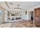 Bright dining area with tile flooring and views into the living room at 4327 Melrose Abbey Pl, Las Vegas, NV 89141