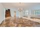 Formal dining room with marble floors and a chandelier at 4327 Melrose Abbey Pl, Las Vegas, NV 89141
