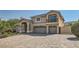 Two-story house with a three-car garage and a landscaped front yard at 4327 Melrose Abbey Pl, Las Vegas, NV 89141