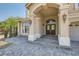 Elegant entryway with arched entry and double doors at 4327 Melrose Abbey Pl, Las Vegas, NV 89141