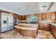 Gourmet kitchen with granite island and stainless steel appliances at 4327 Melrose Abbey Pl, Las Vegas, NV 89141