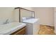 Laundry room with washer, dryer, and utility sink at 4327 Melrose Abbey Pl, Las Vegas, NV 89141