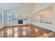 Spacious living room with hardwood floors and a fireplace at 4327 Melrose Abbey Pl, Las Vegas, NV 89141