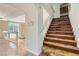 Elegant staircase with wood steps and tile flooring at 4327 Melrose Abbey Pl, Las Vegas, NV 89141