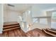 Upstairs hallway with hardwood floors and access to bedrooms at 4327 Melrose Abbey Pl, Las Vegas, NV 89141