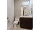 Modern bathroom with dark vanity and tiled walls at 120 Los Cabos Dr # 301, Las Vegas, NV 89144