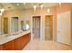 Bathroom with double vanity, large shower, and separate toilet area at 2877 Paradise Rd # 104, Las Vegas, NV 89109