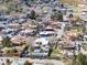 Elevated neighborhood view with diverse homes, reflecting community warmth, trees, and streets at 16 Cerrito St, Blue Diamond, NV 89004