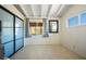 Bedroom featuring beamed ceilings, blue closet doors and plenty of sunlight at 16 Cerrito St, Blue Diamond, NV 89004