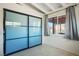Bedroom featuring beamed ceilings, blue closet doors and sunlight at 16 Cerrito St, Blue Diamond, NV 89004