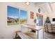 Inviting dining area with a backyard view and decorative accents create a warm, comfortable space at 16 Cerrito St, Blue Diamond, NV 89004
