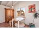 Inviting dining area featuring a rustic wooden hutch and charming decor at 16 Cerrito St, Blue Diamond, NV 89004