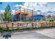 Exterior view featuring a multilevel deck, rock wall and landscaped yard at 16 Cerrito St, Blue Diamond, NV 89004