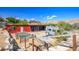 Exterior shot of a home with garden beds, a camper and mountain views at 16 Cerrito St, Blue Diamond, NV 89004