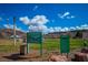 Image showing a park sign with green grass, trees and mountains in the background, adding a serene touch at 16 Cerrito St, Blue Diamond, NV 89004