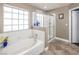 Bathroom with soaking tub and walk-in shower at 5413 Lochmor Ave, Las Vegas, NV 89130