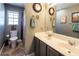 Clean bathroom with double vanity, large mirror, and shower/tub combo at 5413 Lochmor Ave, Las Vegas, NV 89130