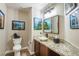 Elegant bathroom with granite countertop, vessel sink, and framed art at 5413 Lochmor Ave, Las Vegas, NV 89130