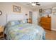 Serene bedroom featuring a light-grey headboard and a lovely patterned quilt at 5413 Lochmor Ave, Las Vegas, NV 89130