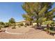 Single-story home with attractive landscaping and desert landscaping at 5413 Lochmor Ave, Las Vegas, NV 89130