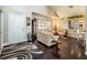 Spacious living room featuring hardwood floors, a fireplace, and ample natural light at 5413 Lochmor Ave, Las Vegas, NV 89130