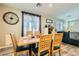 Charming dining room with natural light, a large table, and a view into the cozy living space at 6322 Highledge St, North Las Vegas, NV 89081