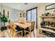 Inviting dining room featuring contemporary decor, a dining table, and ample natural light at 6322 Highledge St, North Las Vegas, NV 89081