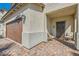 Inviting front porch featuring brick flooring and seating area at 6322 Highledge St, North Las Vegas, NV 89081