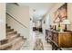 Hallway with staircase and decorative console table at 6322 Highledge St, North Las Vegas, NV 89081